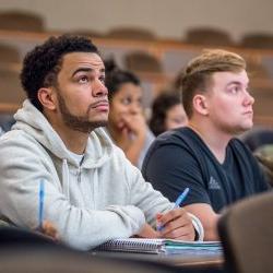 Image of a student sitting in a lecture class.